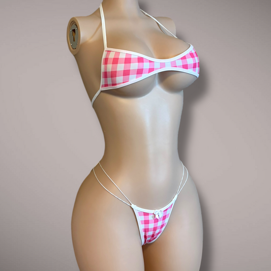 Pink gingham micro bikini on mannequin, front angle, featuring white trim, scoop top, and minimal thong bottoms with double side elastic straps.